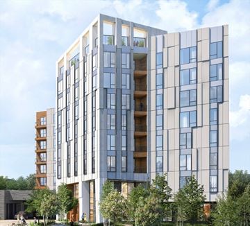 Boston apartment for rent - A modern multi-story building with balconies and large windows.