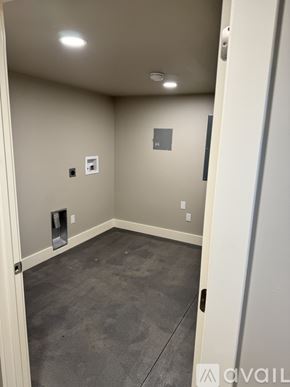 Dayton apartment for rent - A room with a door and a wall socket.