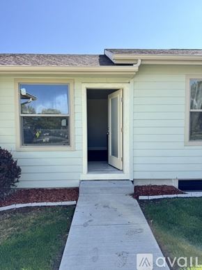 Dayton apartment for rent - A white house with a brown roof and a white door.