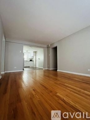 Chicago apartment for rent - A room with wooden flooring and white walls.