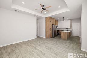 Edinburg apartment for rent - A spacious kitchen with a ceiling fan and lighting fixtures.