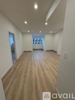 Boston apartment for rent - A room with wooden flooring and a window.