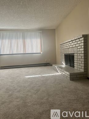 Spokane house for rent - A bathroom with a toilet, sink, and bathtub.