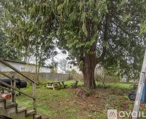Seattle townhouse for rent - A house with a car parked in front of it.