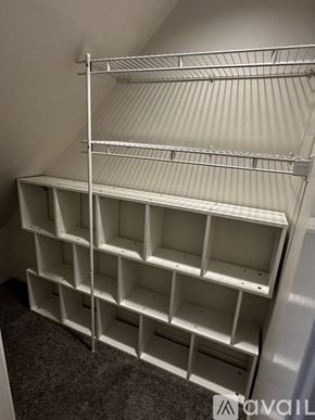Seattle townhouse for rent - A room with a tiled floor and a white door.