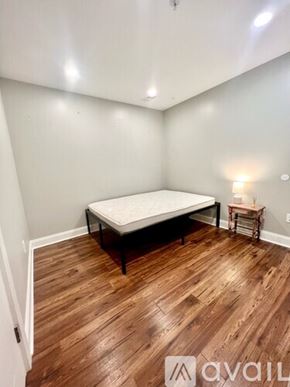 Washington condo for rent - A bedroom with a bed and a small table.