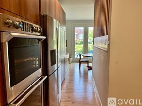 St. Louis house for rent - A kitchen with a stainless steel oven and refrigerator.