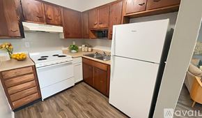 Muncie apartment for rent - A room with a brown carpet and a white door.