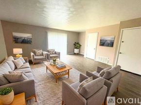 Muncie apartment for rent - A room with wooden flooring and two white doors.