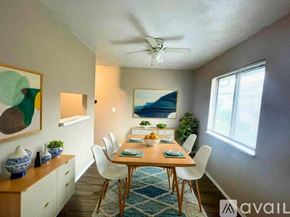 Muncie apartment for rent - A room with a ceiling fan and a window with blinds.