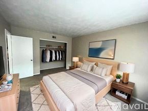 Muncie apartment for rent - A room with a carpeted floor and a window with blinds.