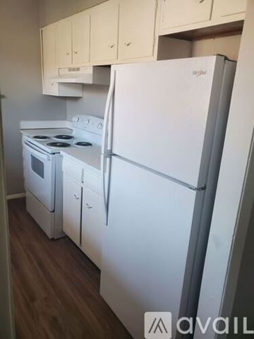 Muncie apartment for rent - A white fridge and stove in a kitchen.