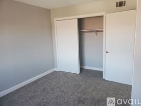 Muncie apartment for rent - A room with a white door and a grey carpet.