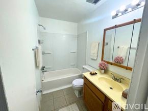 Muncie townhouse for rent - A room with carpeted floor and four doors.