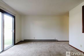 Garrett apartment for rent - A room with a carpeted floor and a sliding glass door.