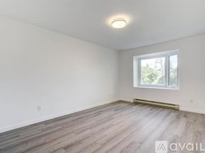 Schiller Park apartment for rent - A room with a window and wooden flooring is available for rent.
