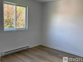 Schiller Park apartment for rent - A room with a window and a wall-mounted heater.