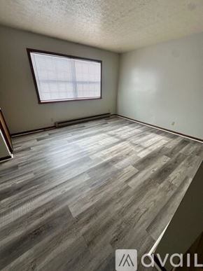 Woodburn apartment for rent - A room with wooden flooring and a window.