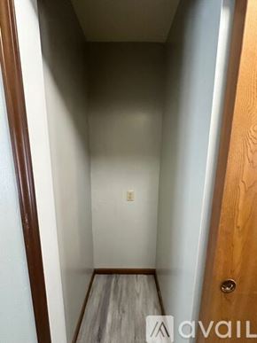 Woodburn apartment for rent - A narrow hallway with wooden floors and white walls.