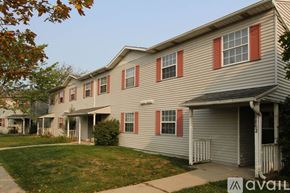 Woodburn apartment for rent - A row of houses with the front of the first one visible.