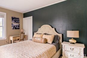 Highland Falls house for rent - A bedroom with a bed, nightstand, and lamp.