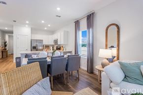 Orange Park townhouse for rent - A floor plan of a house with a patio, family room, cafe, kitchen, powder room, entry, and 1-car garage.