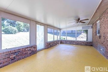 Columbus house for rent - A kitchen with white cabinets and a stainless steel refrigerator.