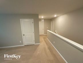 King house for rent - A room with a carpeted floor and white walls.