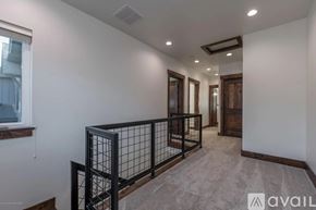 Victor house for rent - A spacious room with a balcony and a window.