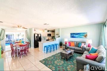 Bradenton house for rent - A living room with a grey couch and a coffee table.