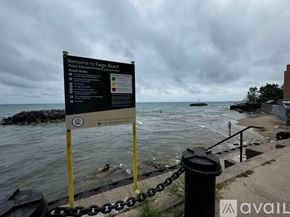 Chicago apartment for rent - A sign welcoming visitors to Fargo Beach is displayed on a cloudy day.