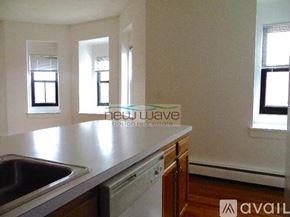 Boston apartment for rent - A kitchen with a sink and a window.
