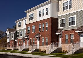 Ewing apartment for rent - a row of brick and white town houses on a street