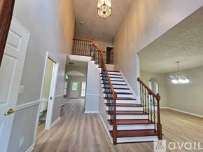Louisville house for rent - A hallway with a staircase leading to the second floor.