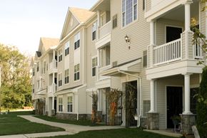 West Deptford apartment for rent - a row of houses with a sidewalk in front of them