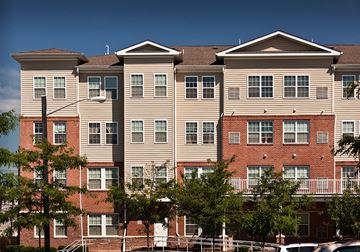 Elizabeth apartment for rent - a large apartment building with red brick and tan siding