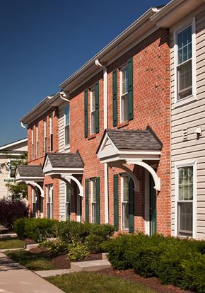 Elizabeth apartment for rent - a red brick building with white siding and green windows