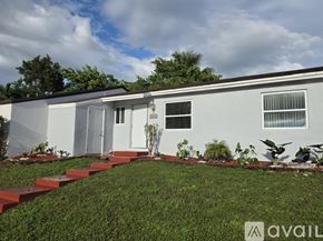 Cutler Bay apartment for rent - A modern kitchen with a sink and cabinets.