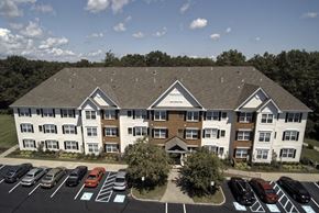 Ocean Township apartment for rent - an aerial view of an apartment building with a parking lot