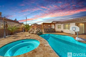 Lake Havasu City house for rent - A pool with a basketball hoop in the middle of it.