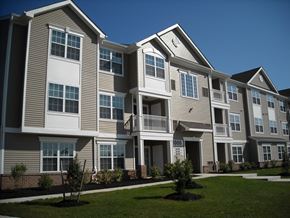 Mount Royal apartment for rent - an exterior view of an apartment building on a sunny day