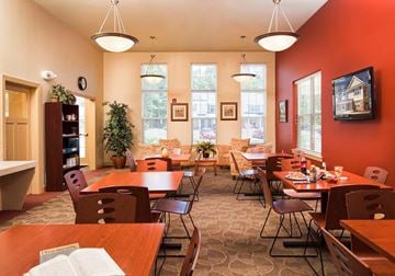 Toms River apartment for rent - a dining room with tables and chairs and windows
