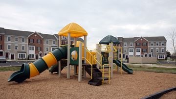 Woolwich Twp apartment for rent - a playground with a slide and other playground equipment in front of apartments