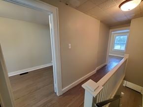Lima apartment for rent - A room with a window and a white railing.