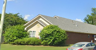 Tupelo house for rent - A house with a car parked in front.