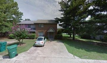 Tupelo apartment for rent - A car is parked in a driveway in front of a house.