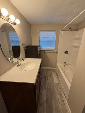 St. Augustine house for rent - A bathroom with a sink, mirror, and bathtub.