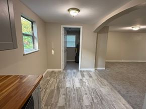 St. Augustine house for rent - A room with a wooden counter top and a window with a view of trees outside.
