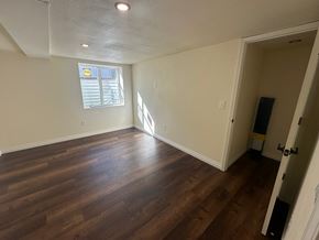 Sunnyside house for rent - A room with wooden floors and a window letting in sunlight.