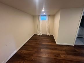 Sunnyside house for rent - A long, narrow room with wooden floors and white walls.
